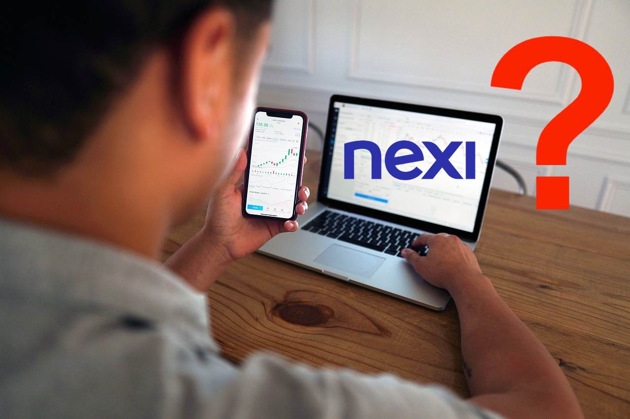 trader al lavoro e logo di Nexi
