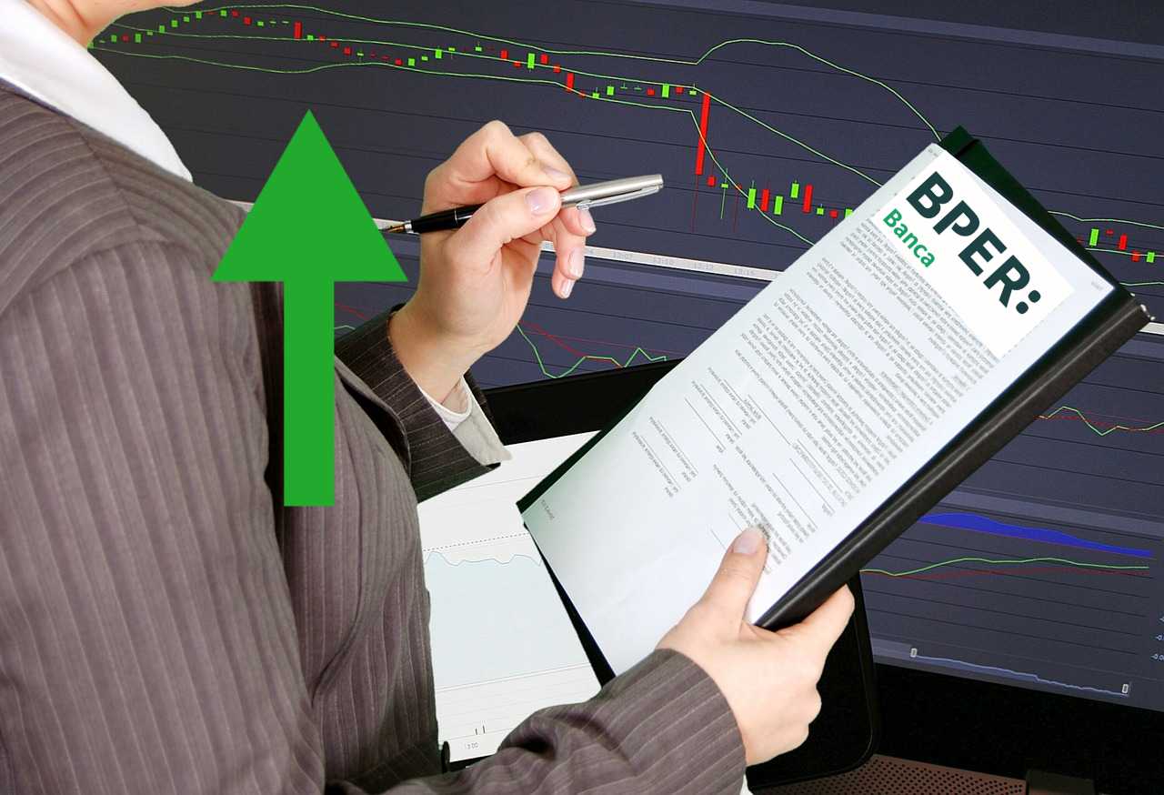trader con dei fogli con logo BPER banca e chart di trading