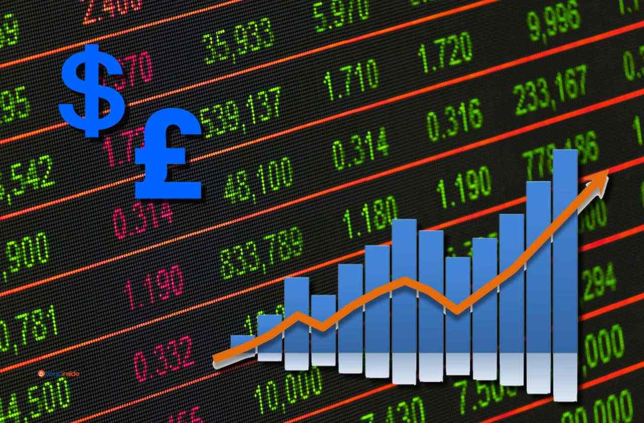 Una tabella con l'andamento dei mercati finanziari con un grafico in sovrimpressione e i simboli di dollaro e sterlina