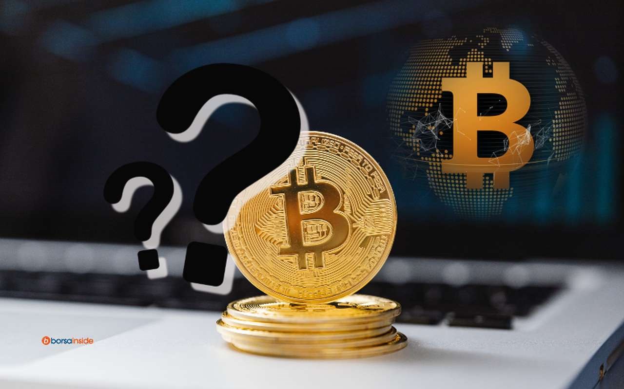 una moneta di Bitcoin e due punti interrogativi in sovrimpressione