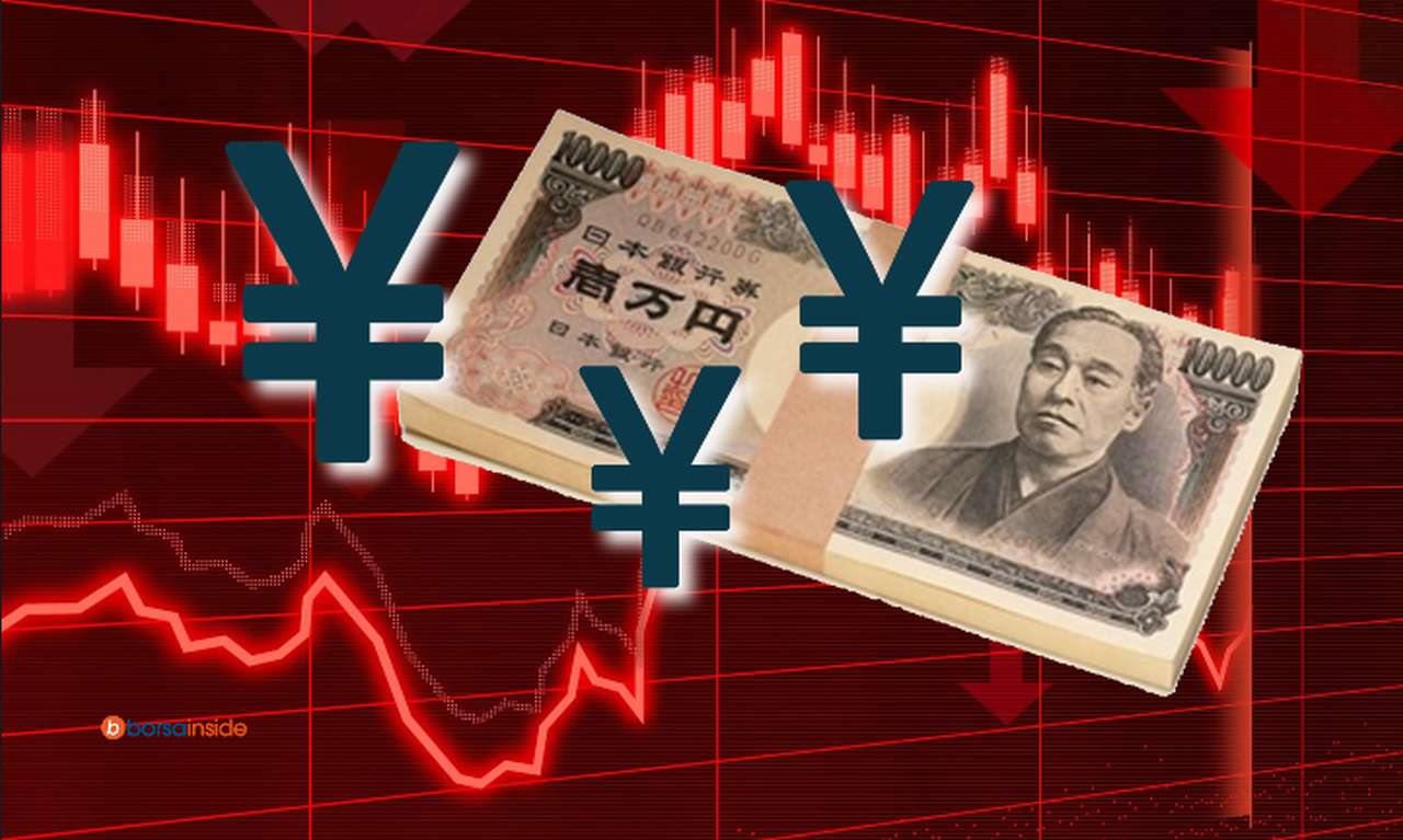un grafico che indica l'andamento di prezzo in toni di rosso, con una mazzetta di yen e il simbolo della moneta in sovrimpressione