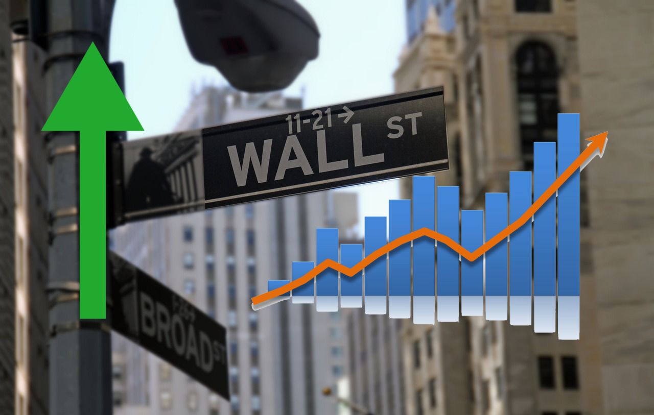 cartello stradale Wall Street e grafico rialzista
