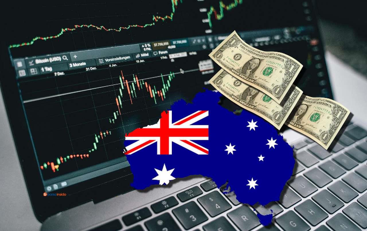 Grafici finanziari sullo schermo di un laptop. In sovrimpressione la bandiera dell'Australia racchiusa nei confini dello Stato e alcune banconote di dollari USA