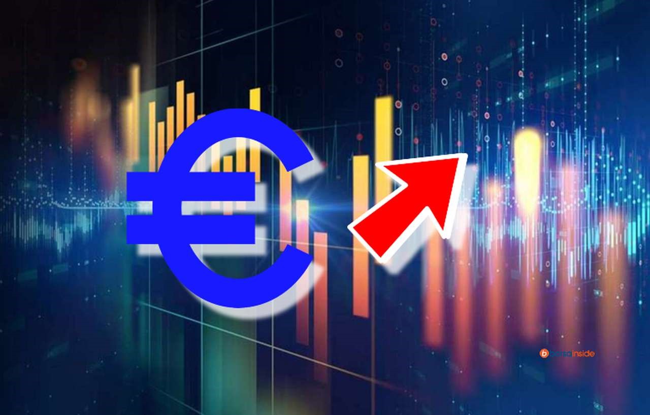 il simbolo dell'euro e una freccia rossa con un grafico a candele sullo sfondo