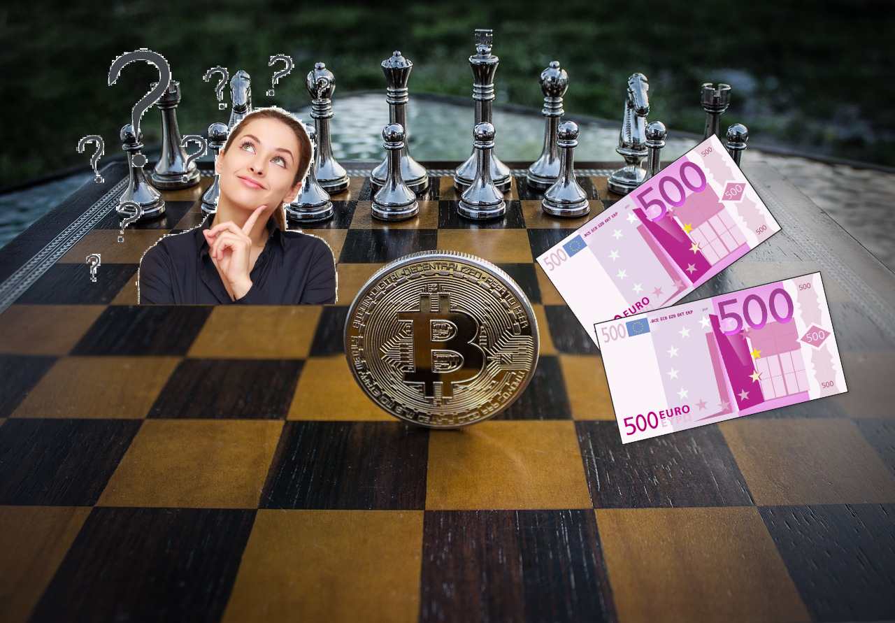 scacchiera con sopra simbolo Bitcoin e due banconote da 500 euro