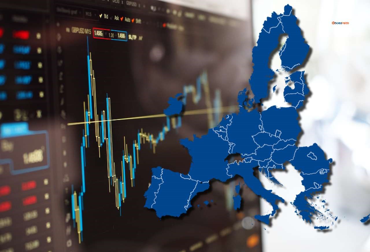 la cartina dell'Unione Europea sulla destra e un grafico finanziario su uno schermo nello sfondo