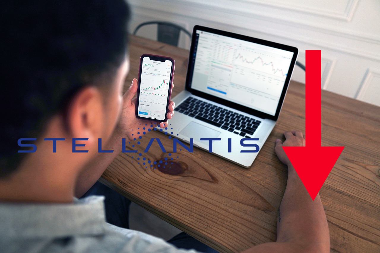 trader in azione con vari dispositivi e logo di Stellantis