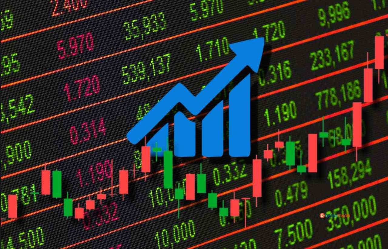 la tabella valori dei titoli con un grafico a candele e una freccia in sovrimpressione