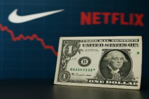 banconota dollari e loghi di Netflix e Nike