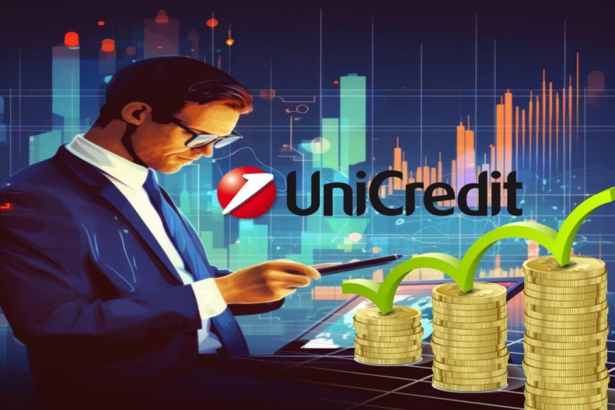 logo di Unicredit e sullo sfondo grafico di borsa con trader