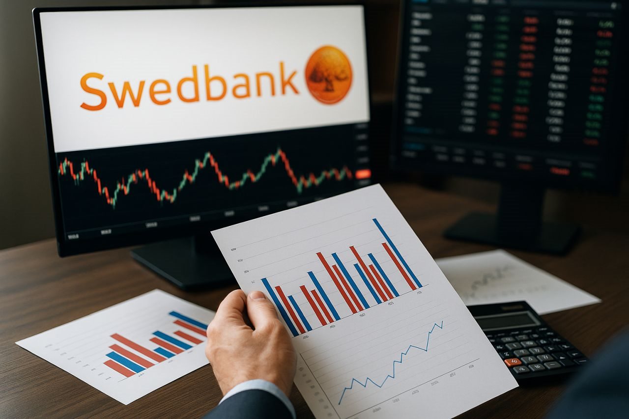 Alcuni fogli con dei grafici finanziari. Sullo sfondo lo schermo di un pc con altri grafici e il logo di Swedbank