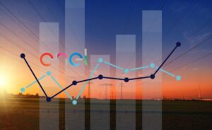 logo di Enel e tramonto con tralicci sullo sfondo