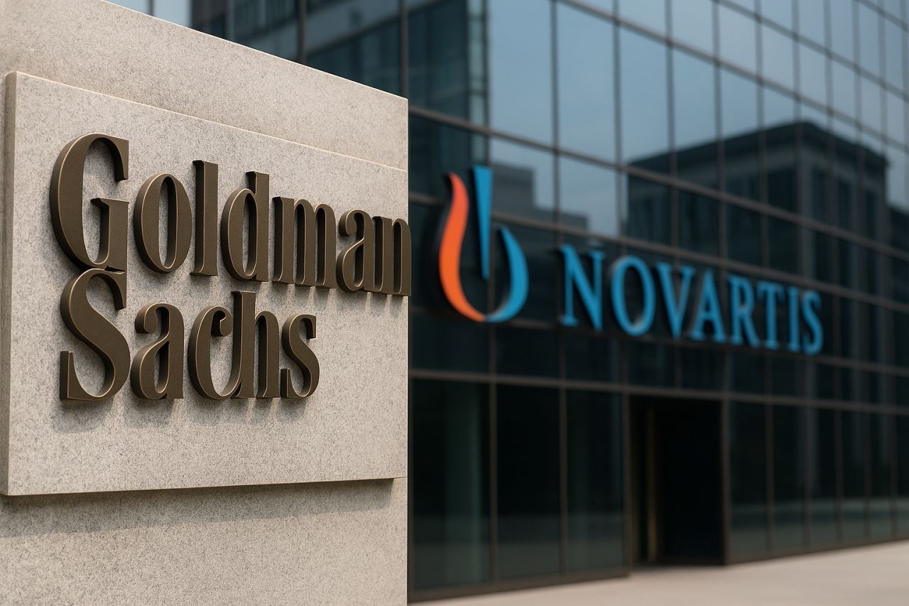 La scritta Goldman Sachs su una parete vicino a una vetrata con la scritta Novartis