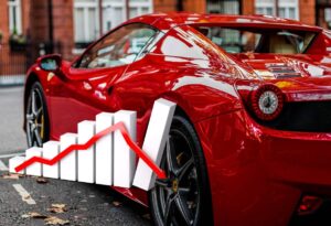 auto Ferrari e grafico con crollo