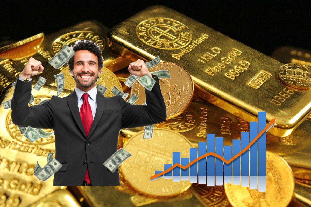 lingotti oro e trader che esulta